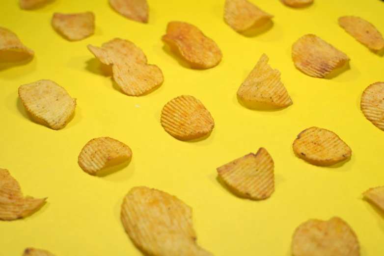 closeup of a yellow surface of potato chips