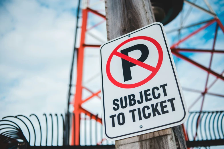 a no parking sign on a telephone pole