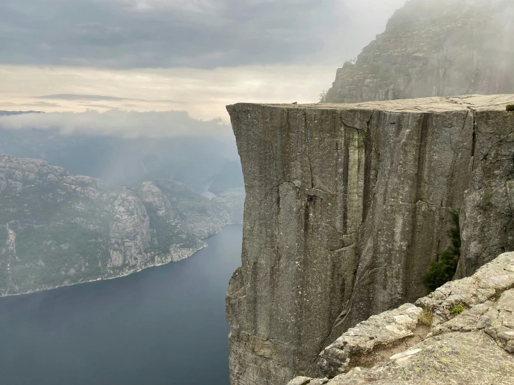 a scenic mountain ledge with an amazing view and the edge of a cliff