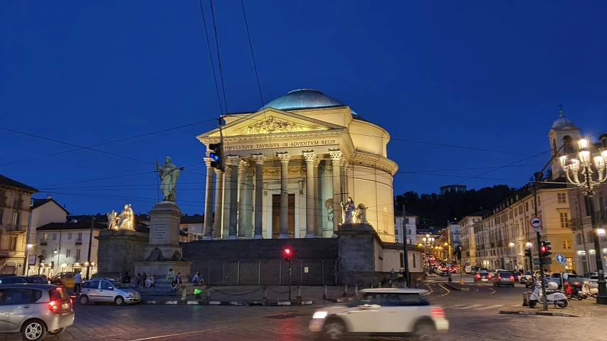 a building with lights shining on the top of it