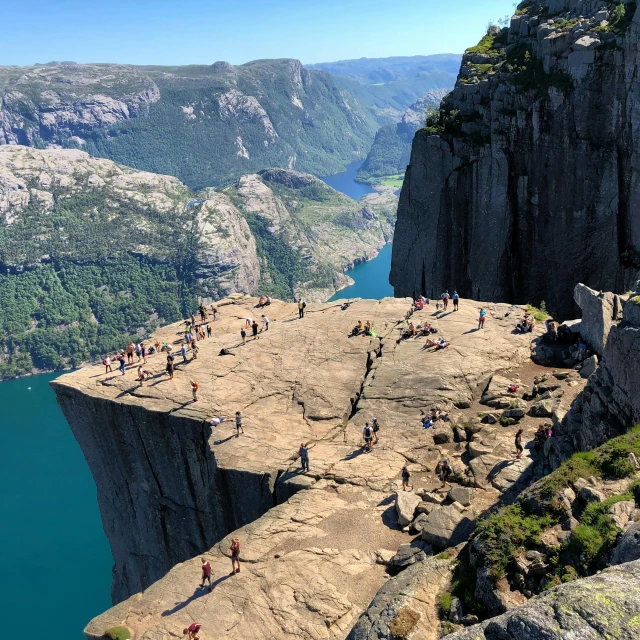 hikers on the edge of a large cliff