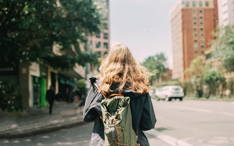 there is a woman walking down the street