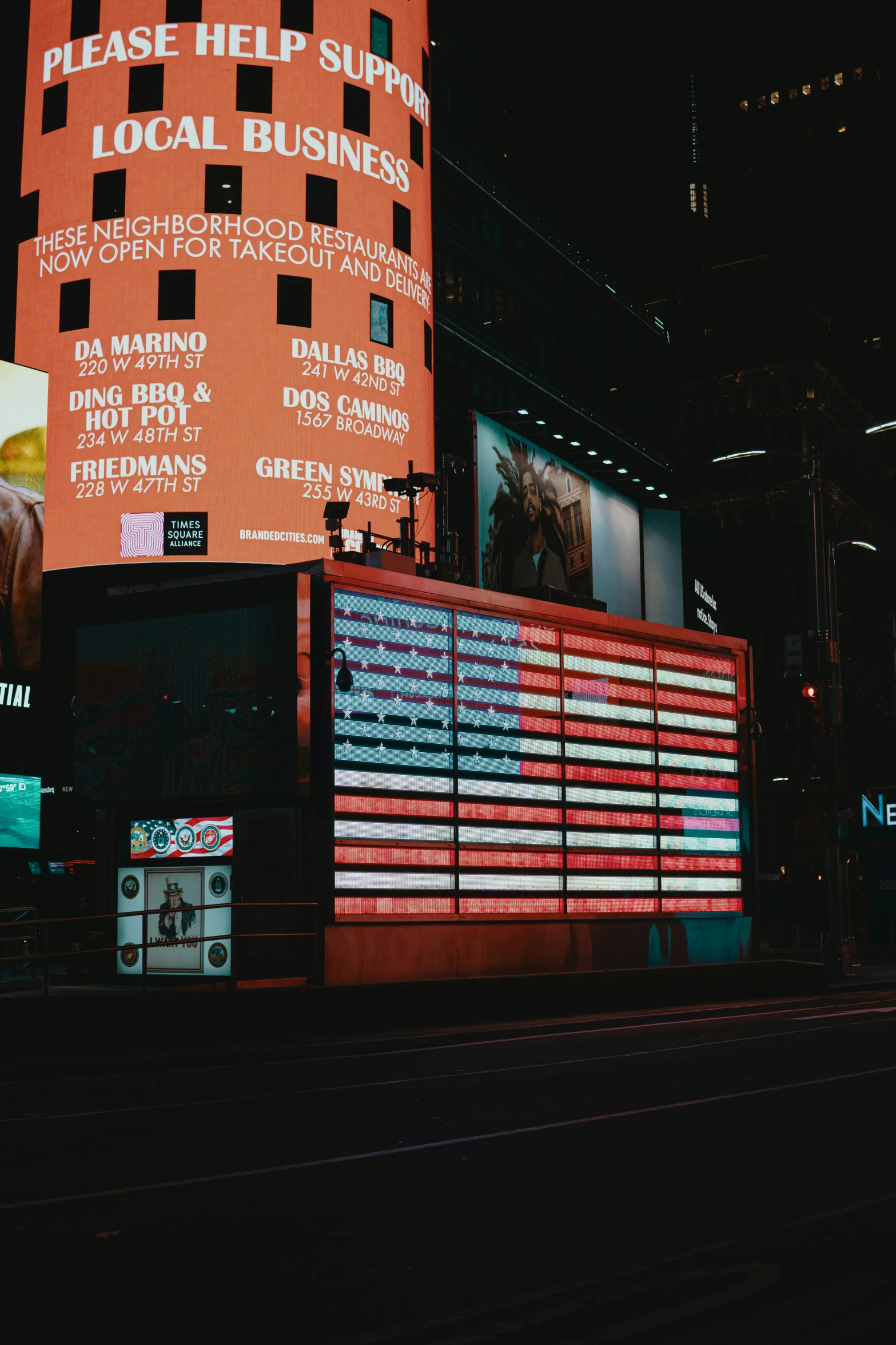 a building that has been lighted by red and white strips of light