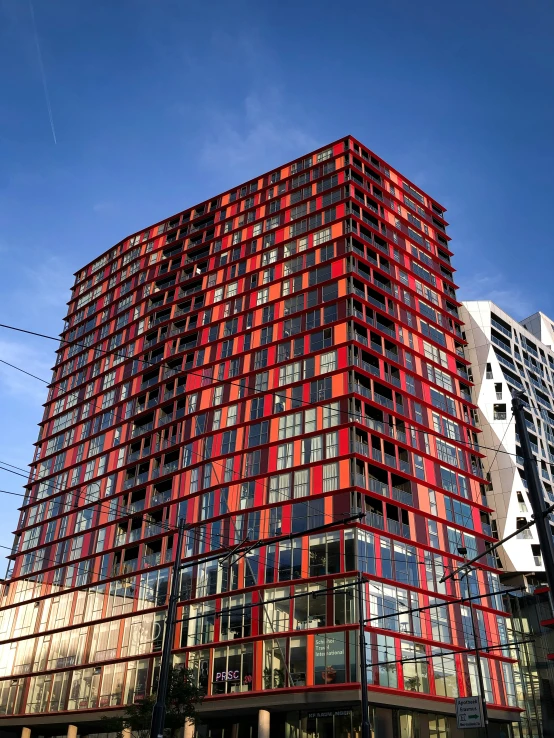 a red and black building in an urban area