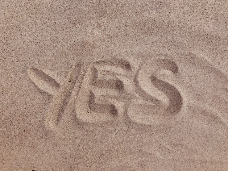 the words jesus spelled out in the sand