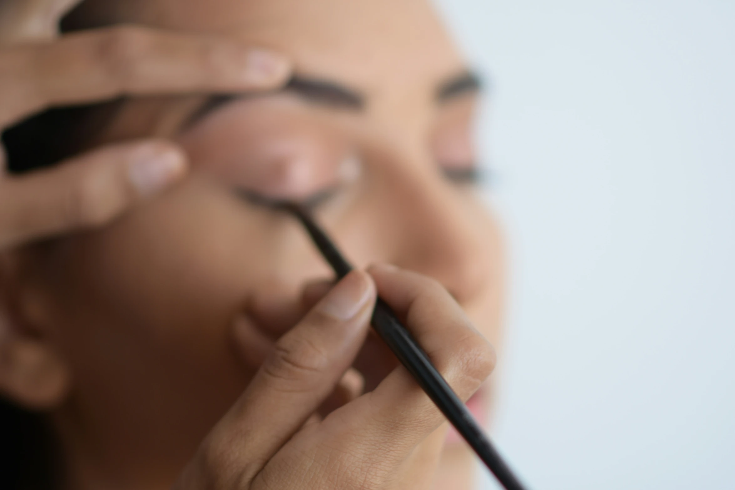 a close - up view of a person getting their make up done