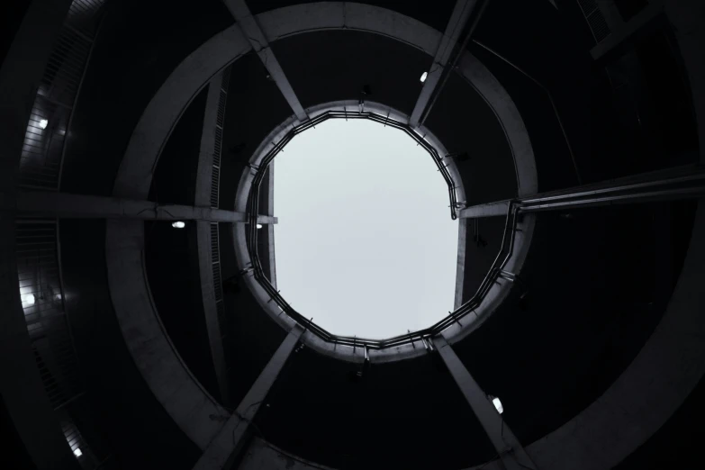 looking up at the sky from inside a tower