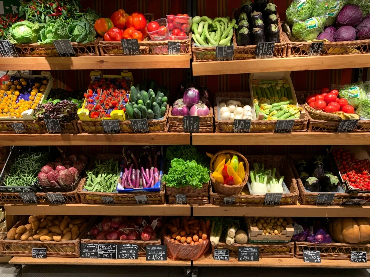 there are a lot of different fruits and vegetables on the shelf