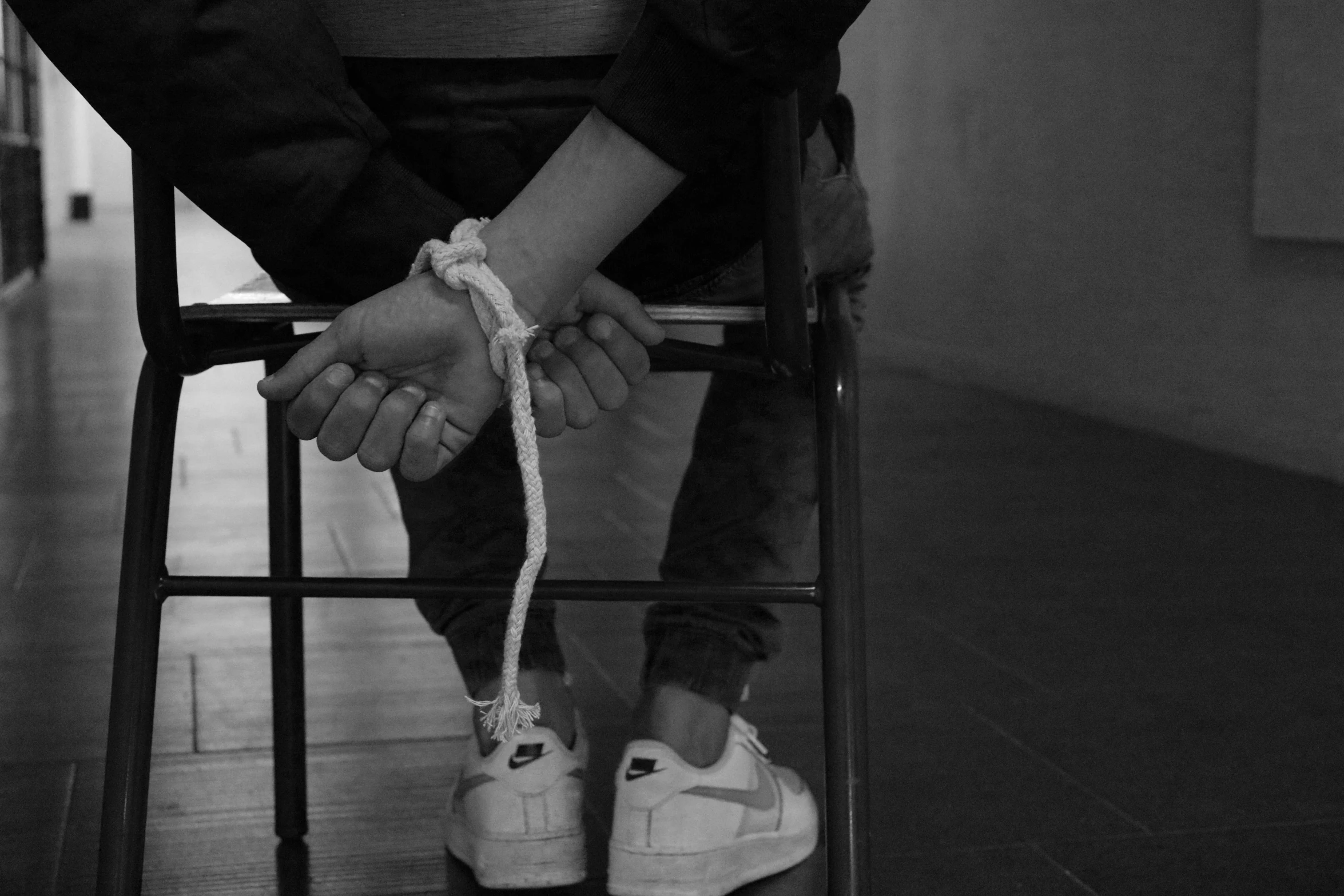 black and white po of two people holding hands