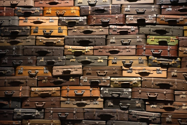 old trunks are all piled up with different colors