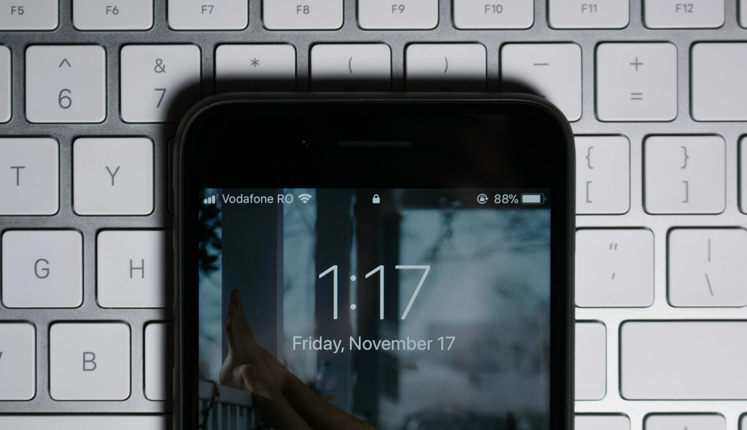 a cell phone displaying the number 11 7 on it