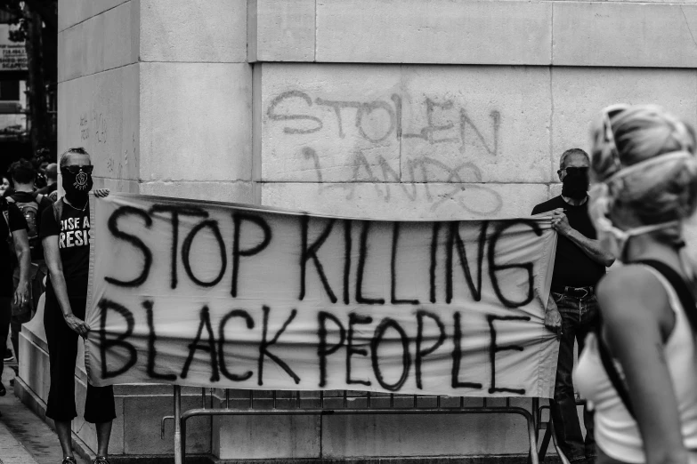 a sign in black and white that says stop ing black people