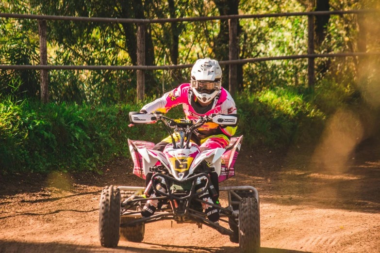 a person on an atv riding around a corner