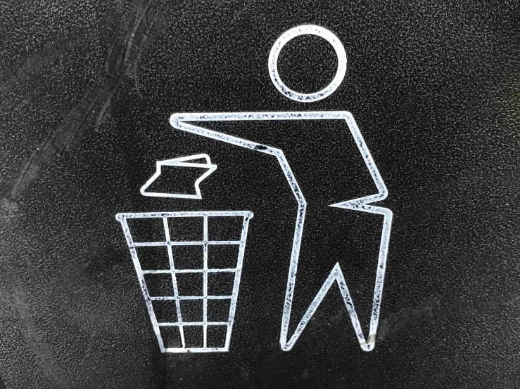 a man throws soing out of a trash can