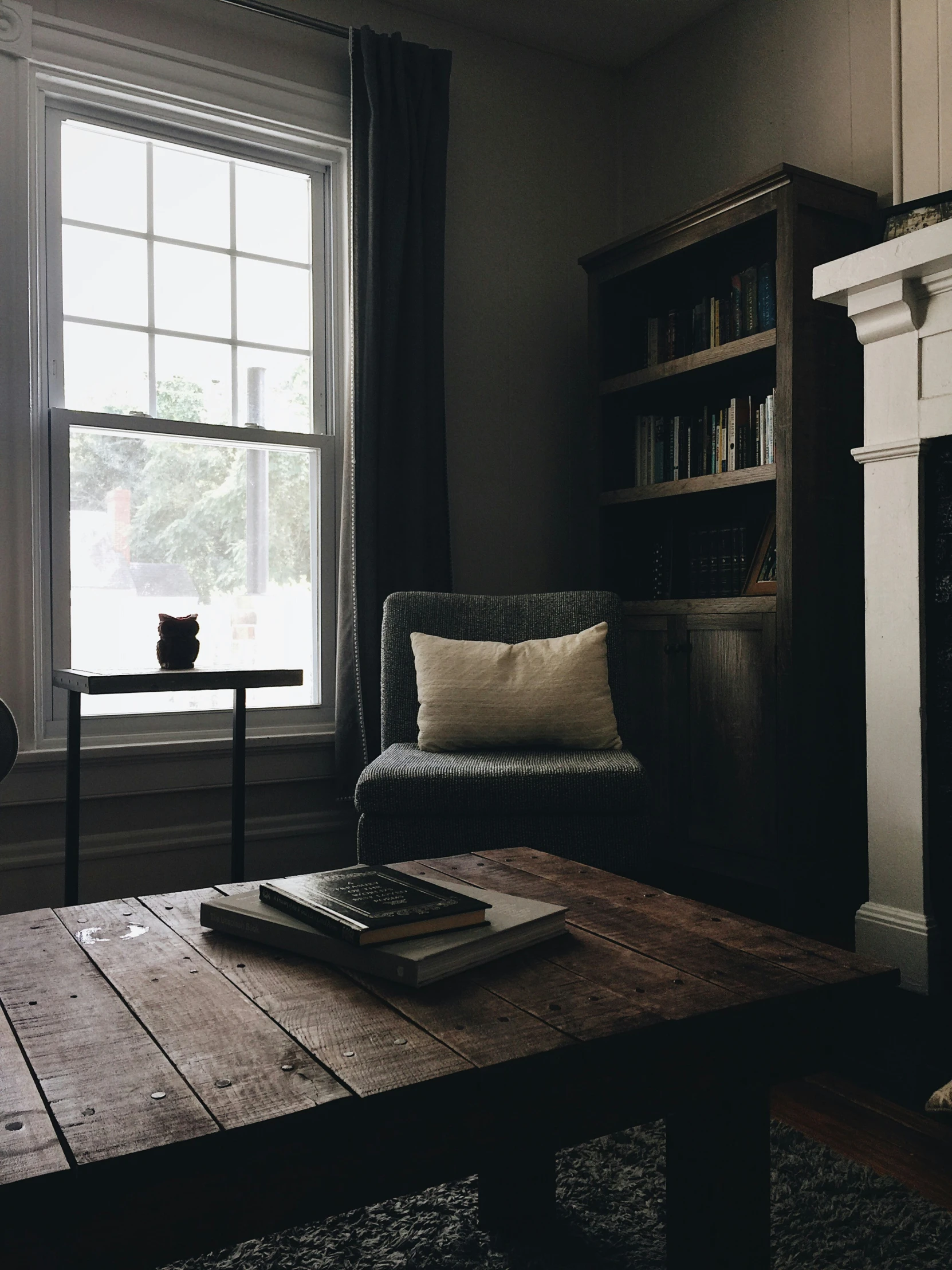 the room is furnished with wood and leather furniture