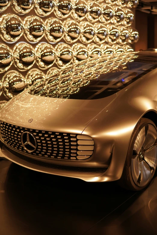 an elaborate, shiny, futuristic vehicle with lights on display