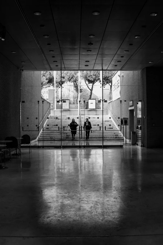 a man stands at the entrance of a room