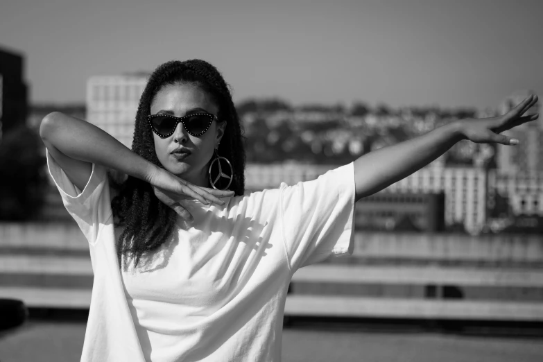 the young woman is wearing glasses and a white shirt