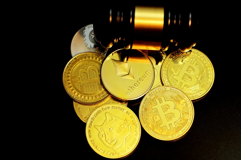 a pile of bitcoins sitting next to a lighter