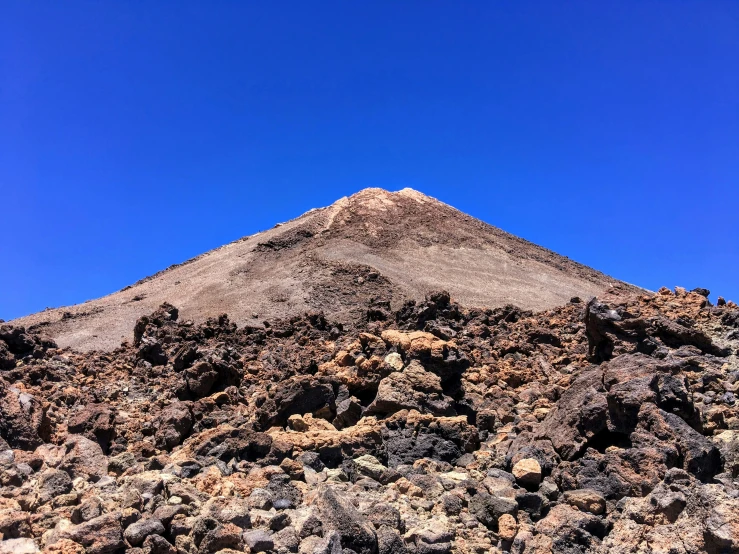 the top of a hill is made of rocks