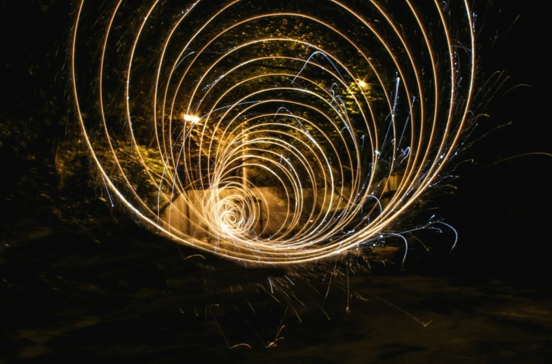 fireworks are shining on the ground and around them