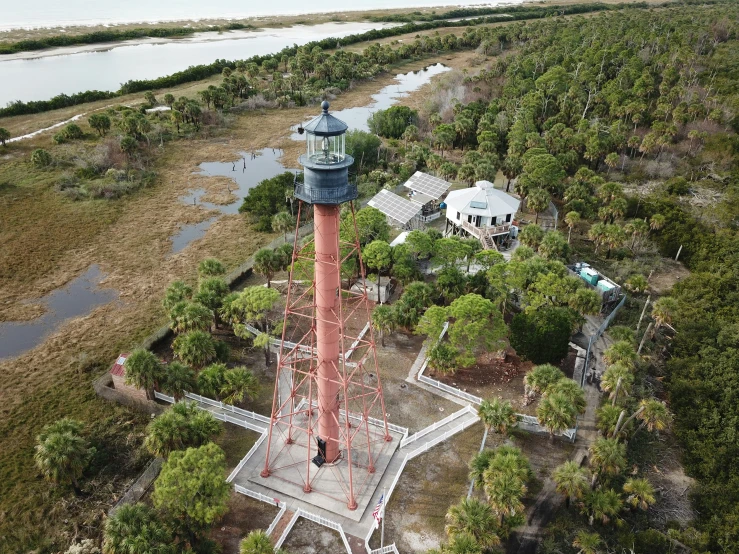 an aerial s of a lighthouse in a small town