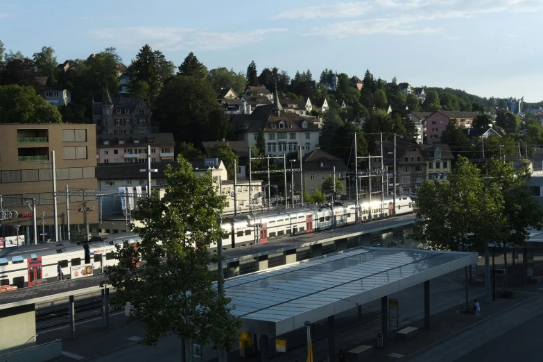 an elevated view of train station in the day light