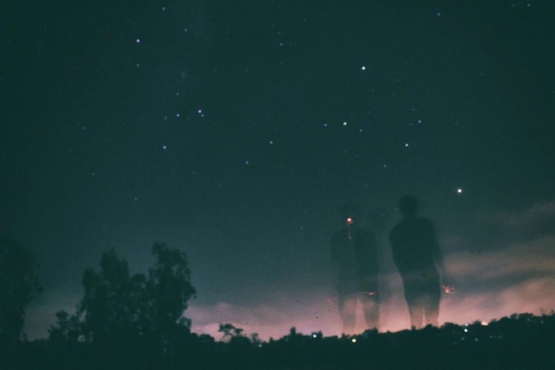 a man and a dog are gazing at the sky