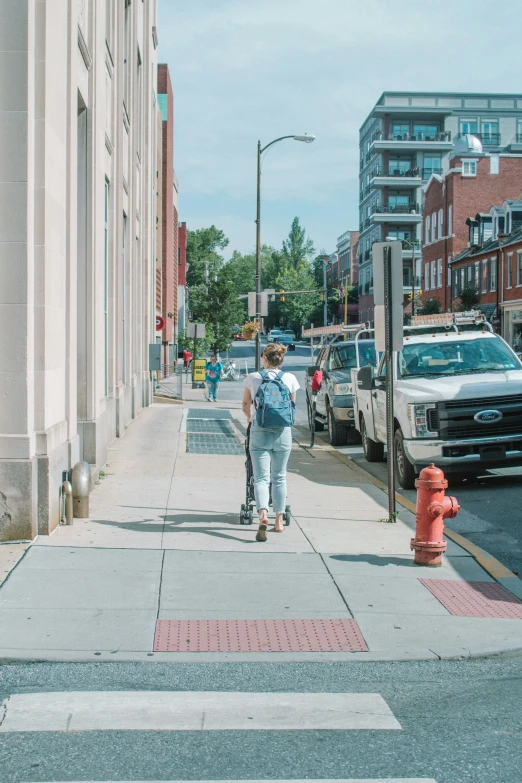 a  with a backpack on a skateboard