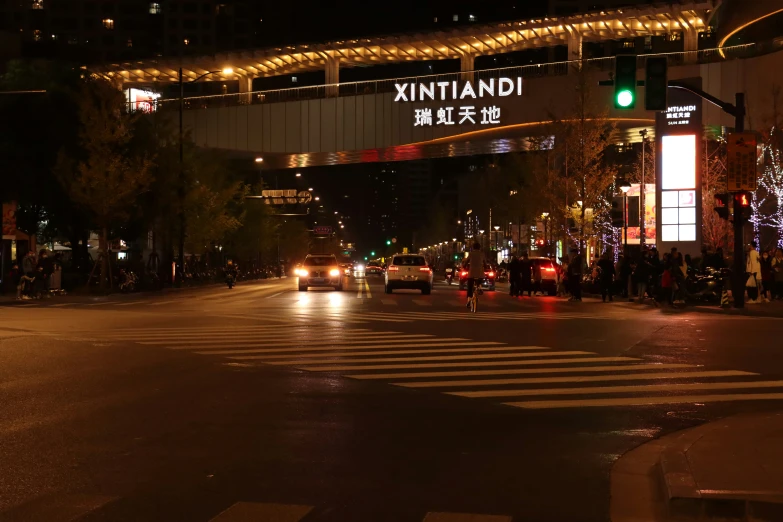 cars and traffic on a city street at night