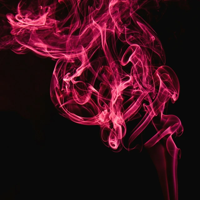 red smoke with long lines against a black background