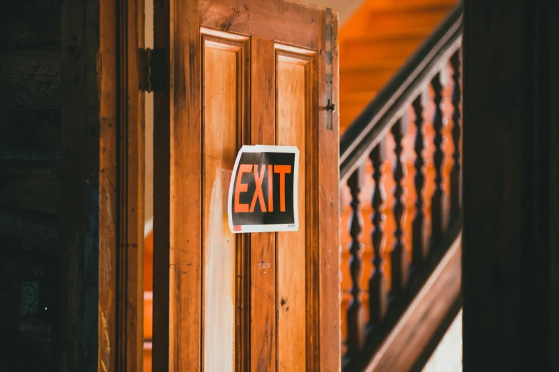 a door that has an exit sign on it