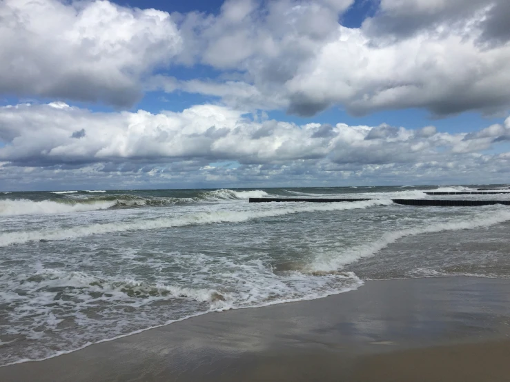 some ships and water and clouds and some water