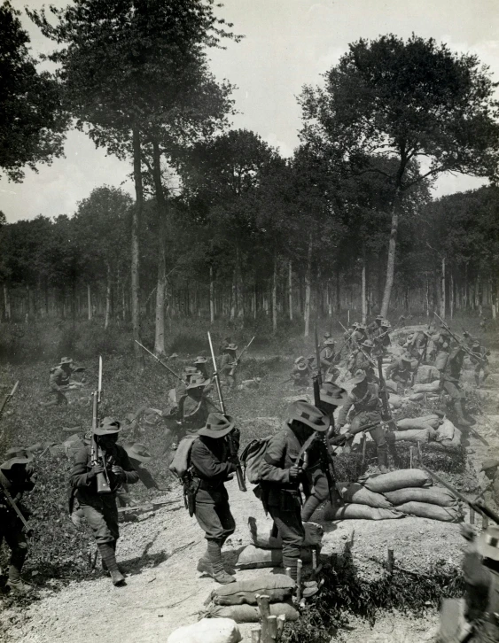 black and white image of soldiers coming out of the woods