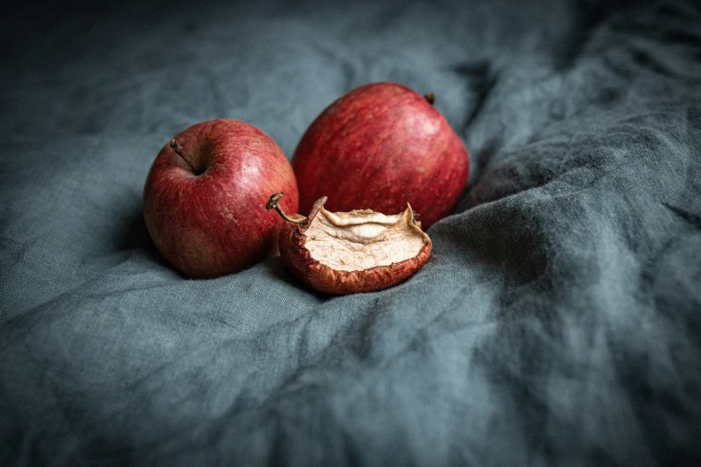 a close up of an apple with an opening