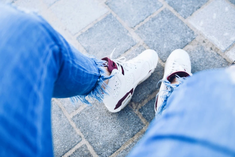 a pair of feet sitting on the ground