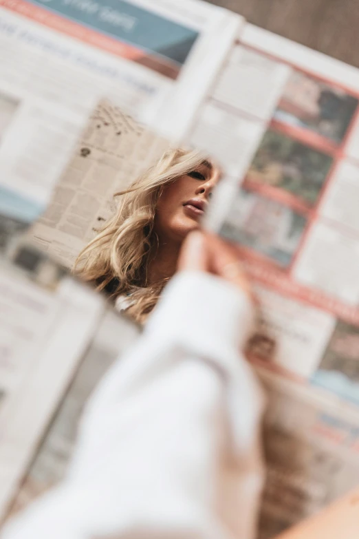 a woman looking at herself in the mirror