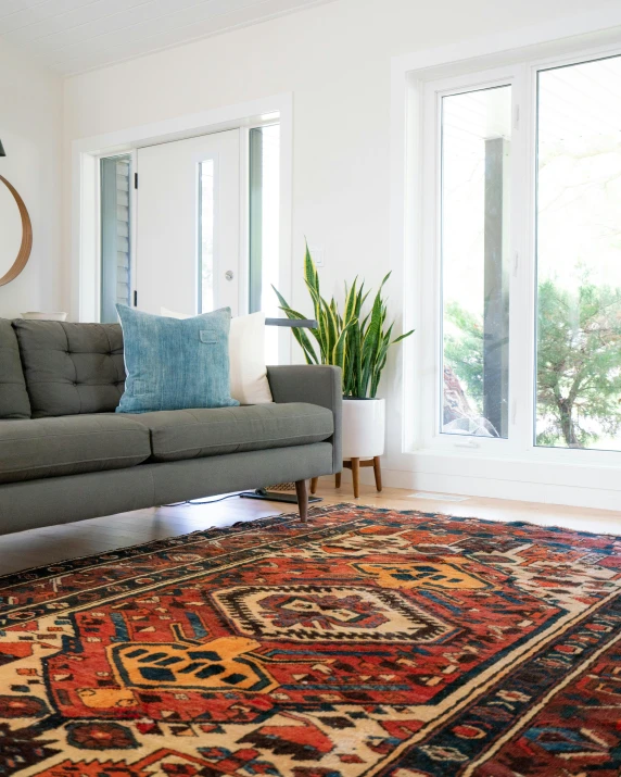 this is a living room with a couch and rug