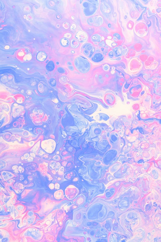 the surface of an orange, green, and purple fluidous substance