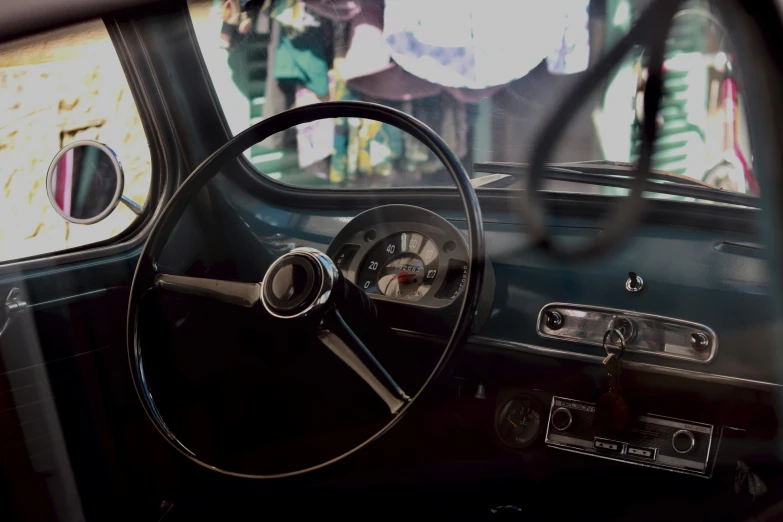 a car's dashboard with a persons reflection in the window