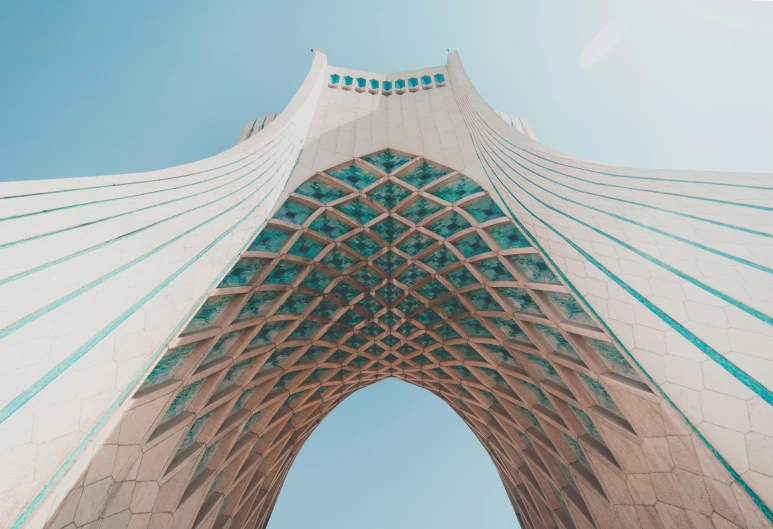 a tall white tower with blue and green lines on it