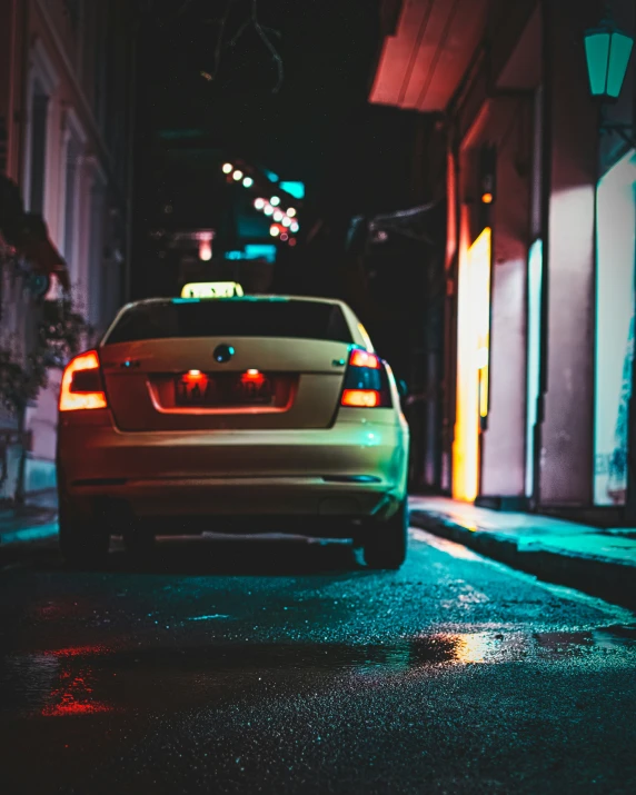 the back view of a car parked at night