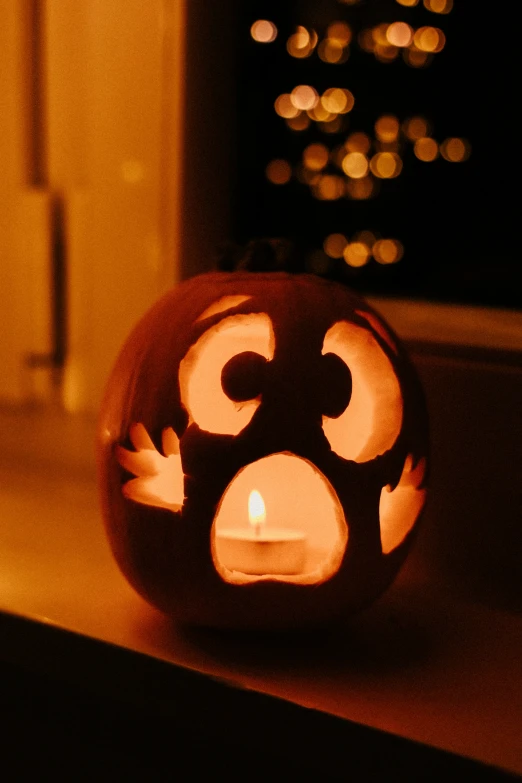 there is a candle inside of a pumpkin