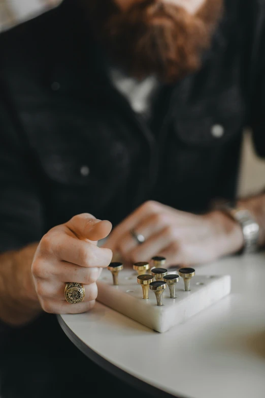 a person putting a ring on each finger