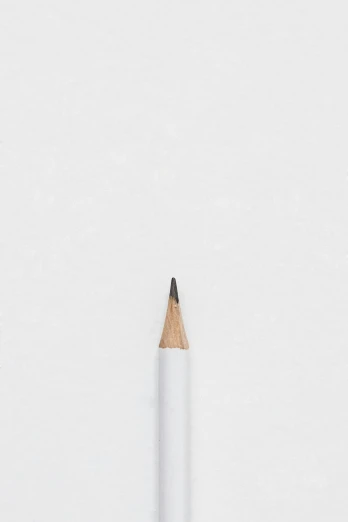 a pencil and a piece of paper sitting in the snow
