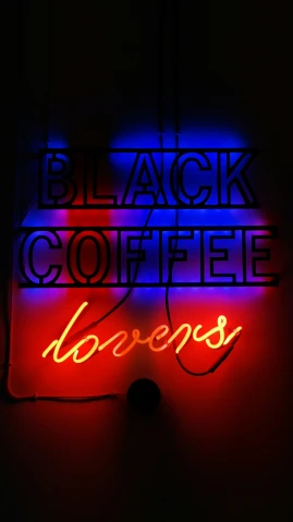 a neon sign that reads black coffee lovers on it