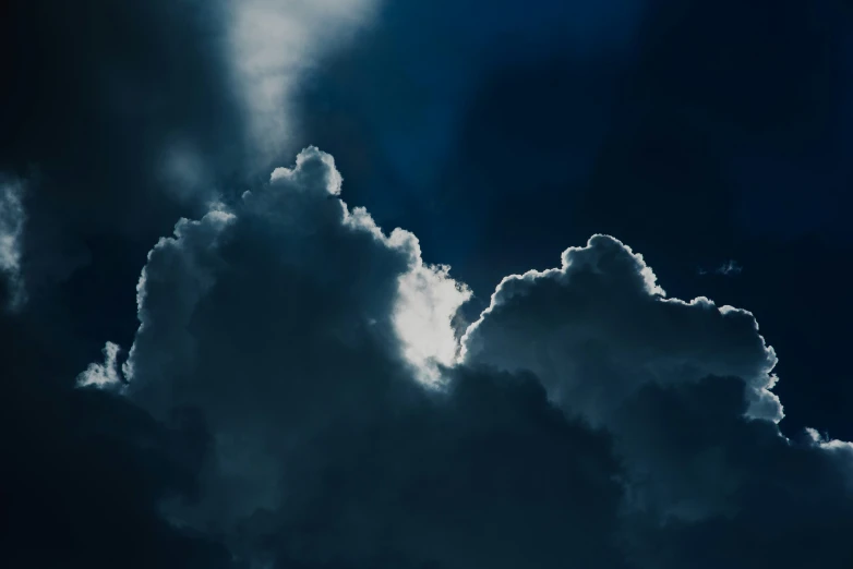 the cloudy sky is almost obscured by a very large cloud