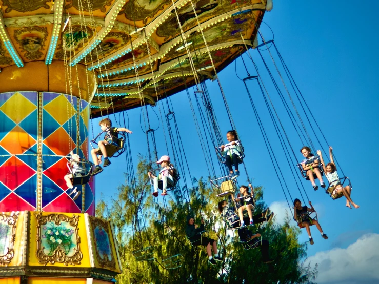 three s on swing wires and a carnival ride