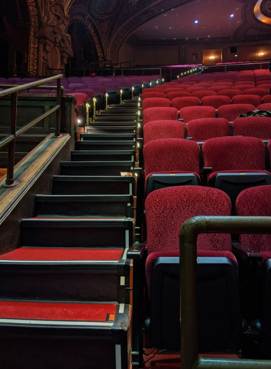 rows of empty chairs sit next to each other