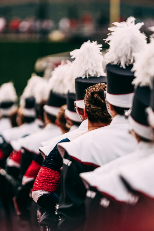 the marching team is marching with their red white and blue colors